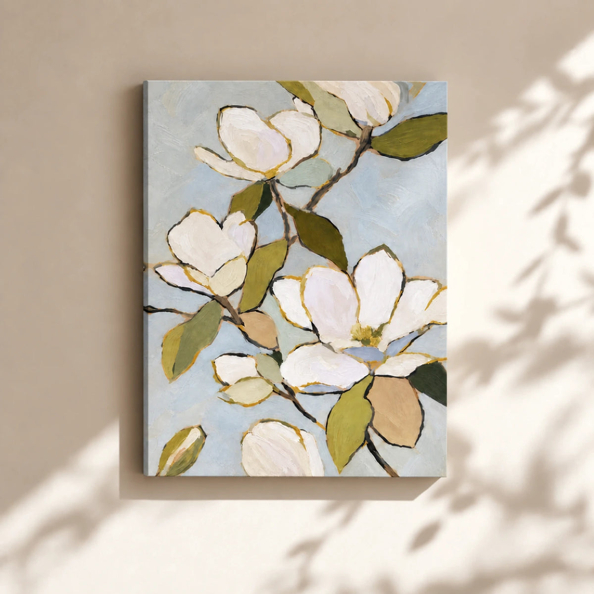 Unframed magnolia canvas on a warm neutral wall with soft sunlight and leaf shadows.