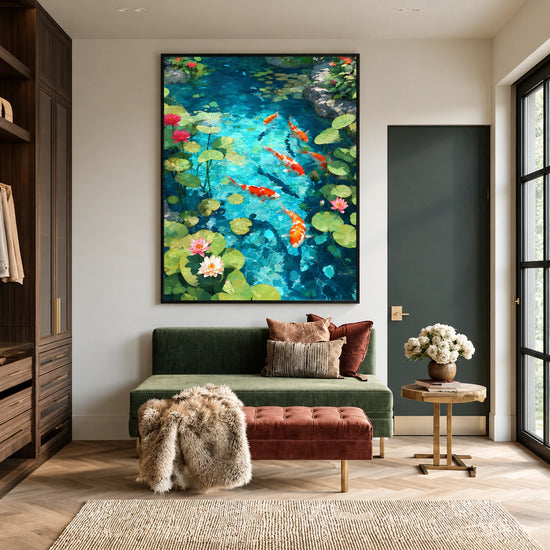 Koi pond painting in a black frame above a green loveseat and rust-colored ottoman.