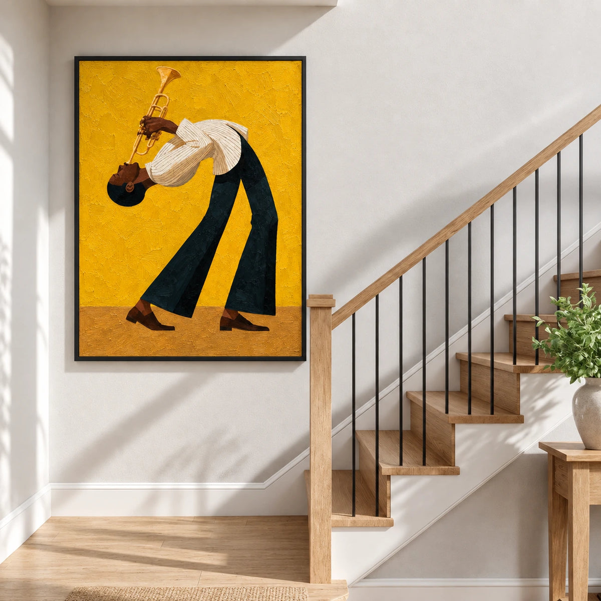 Trumpet player painting in a black frame beside a staircase with wood steps and dark railings.
