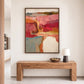 Rose Canyon painting in a brown wood frame above a rustic console with a small lamp.