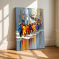 City Parade artwork on stretched canvas without an outer frame, leaning against a sunlit wall.