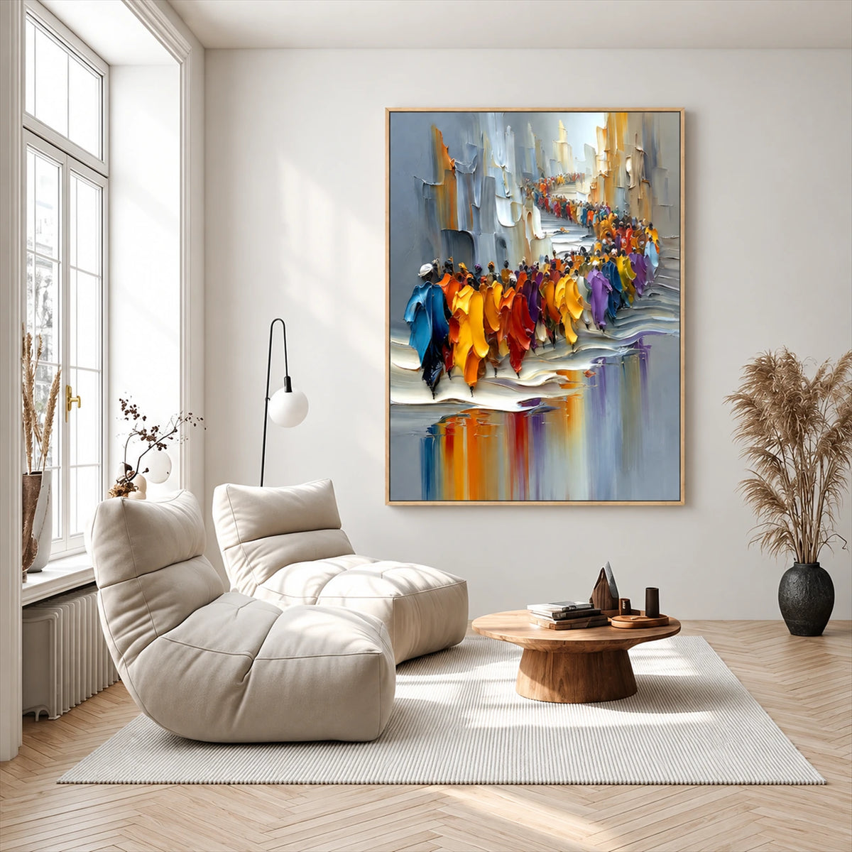 City Parade painting above a white lounge chair in a bright room with tall windows.