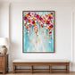 Colorful cascading bloom painting above an upholstered wood bench against white wall paneling.