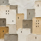 Full artwork of overlapping textured village buildings in ivory, sand and warm gray, with small dark windows and a black doorway.