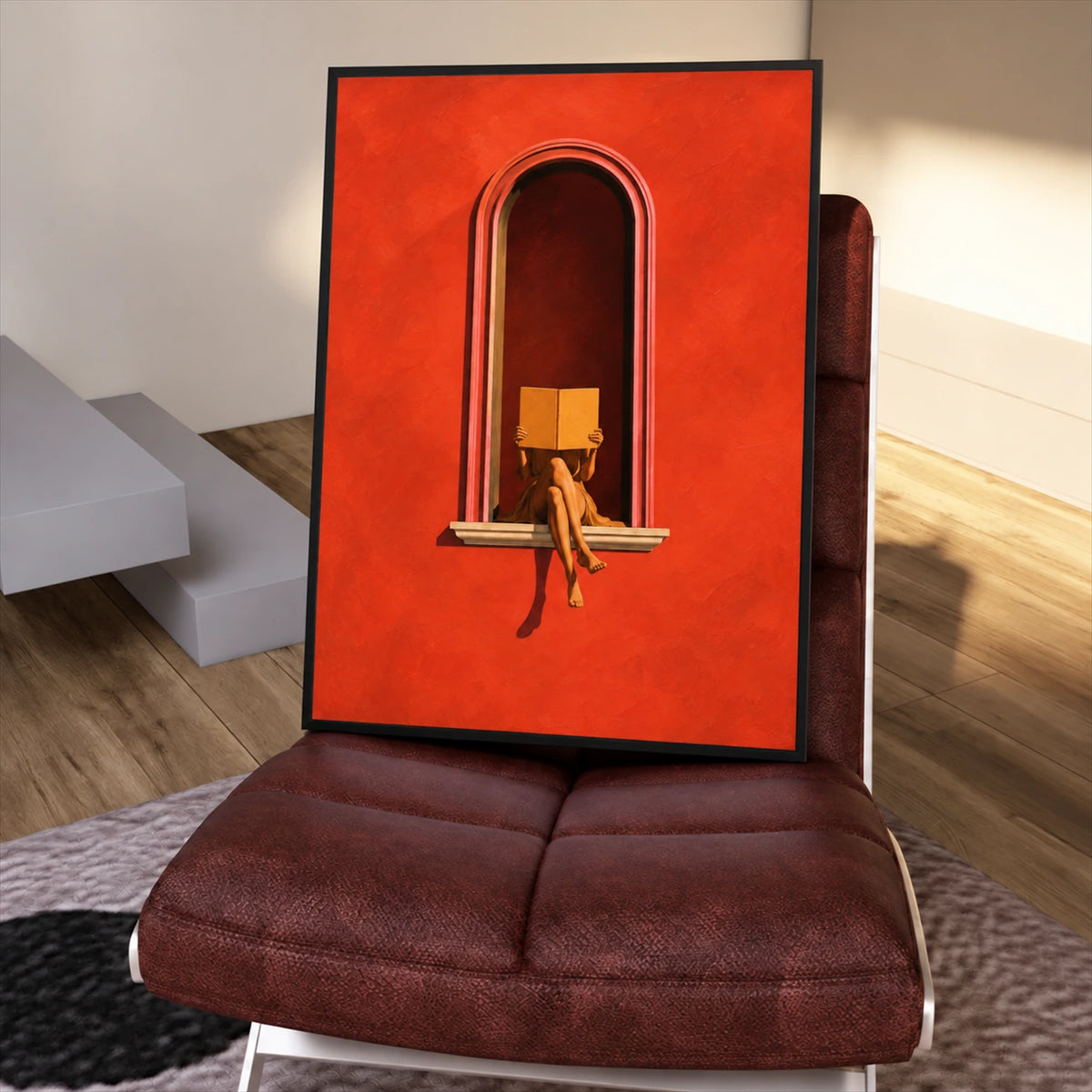 Framed Scarlet Reader painting resting on a burgundy chair in a sunlit interior.