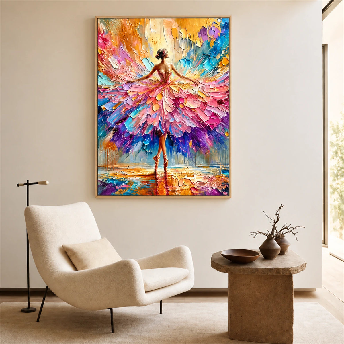 Petal Dancer painting above a cream armchair beside a round wood side table.