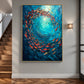 Ocean Swirl painting in a gold-colored frame on a gray wall beside wood stairs and a wall light.