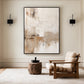 Quiet Earth painting between black wall lights beside a wood lounge chair and a rustic side table.