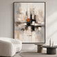Urban Echo painting beside a curved cream sofa and round side tables in a neutral living room.