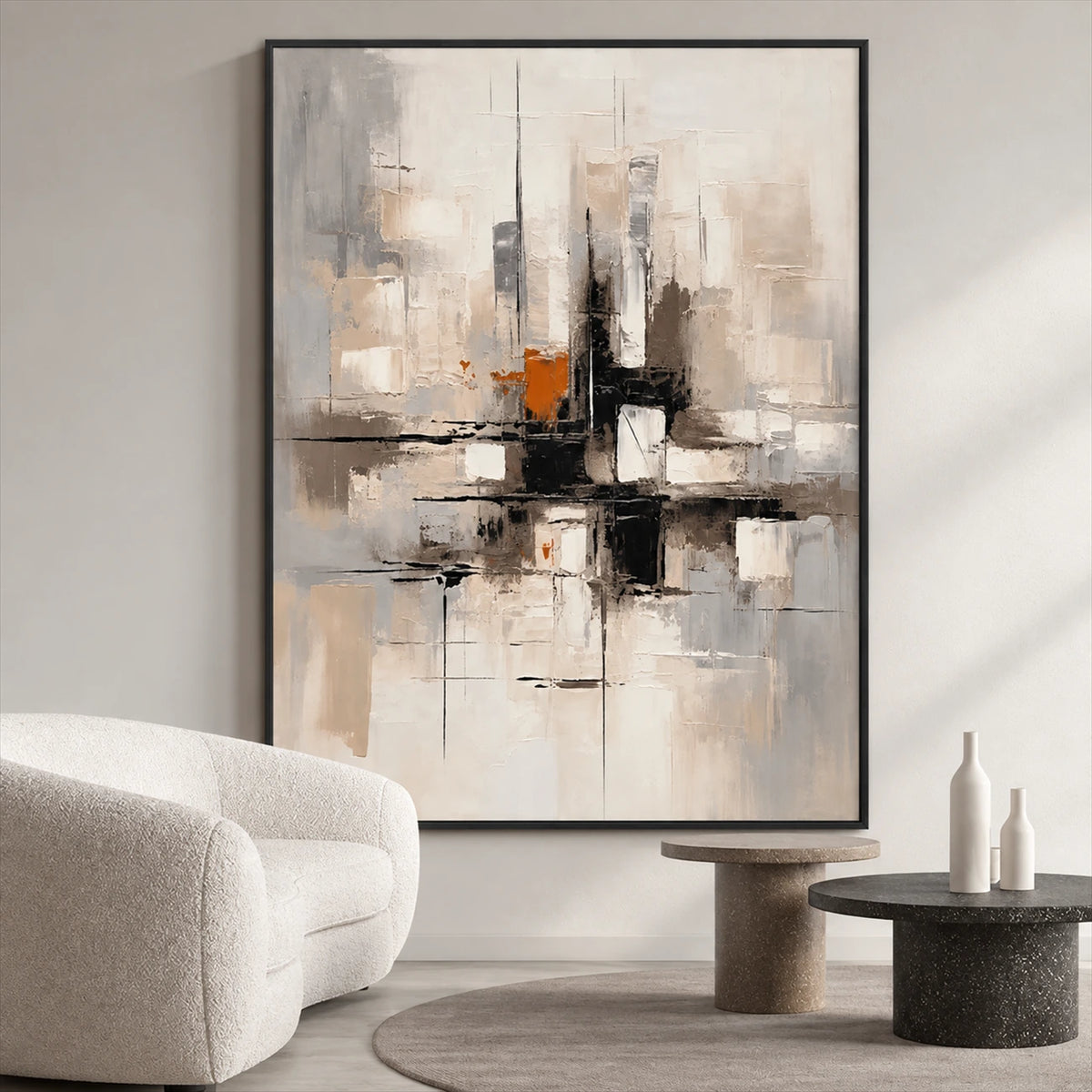 Urban Echo painting beside a curved cream sofa and round side tables in a neutral living room.