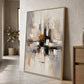 Urban Echo painting in a wood-colored frame leaning against a wall beside a wood cabinet.