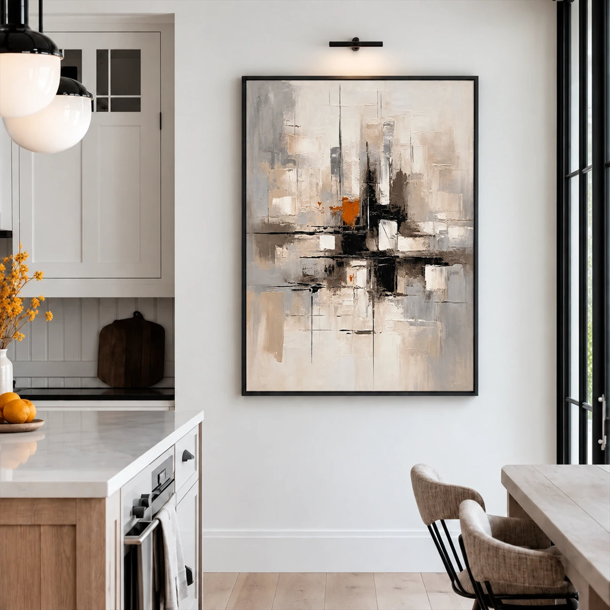 Urban Echo painting under a picture light beside a bright kitchen and dining area.