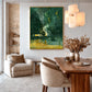 Emerald Haze painting in a gold-colored frame beside a wood dining table and upholstered chairs.