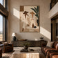 Palm Conversation painting above a long console in a tall living room with leather seating and large windows.