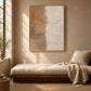 Sandstone Lines painting above a neutral daybed beside a sunlit window.