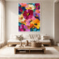Vivid Blooms painting in a white frame above a pale sofa and low wood coffee table.