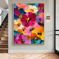Vivid Blooms painting in a gold-colored frame on a gray wall beside wood stairs and a wall light.