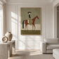 Olive Rider painting on a white paneled wall beside a pale armchair and sculptural ceramics.