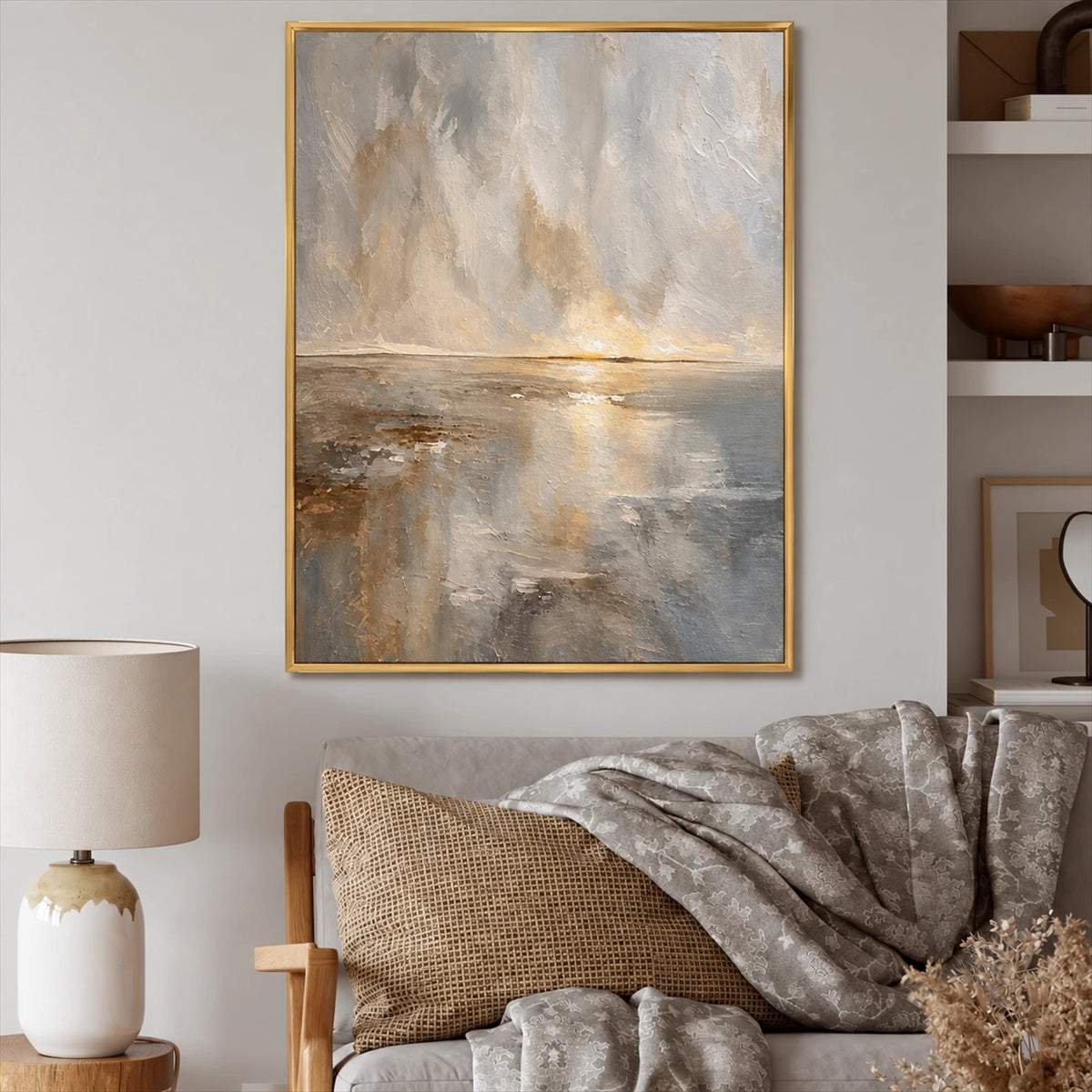 Gilded Horizon painting above a cozy sofa with textured cushions beside a table lamp.