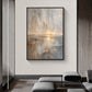 Gilded Horizon painting in a dark frame above gray lounge seating in a minimalist interior.