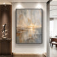Gilded Horizon painting in a dark frame beneath spotlights beside a wood slat feature wall.