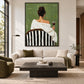 Evening Sip painting above a cream sofa and dark coffee table in a bright living room.