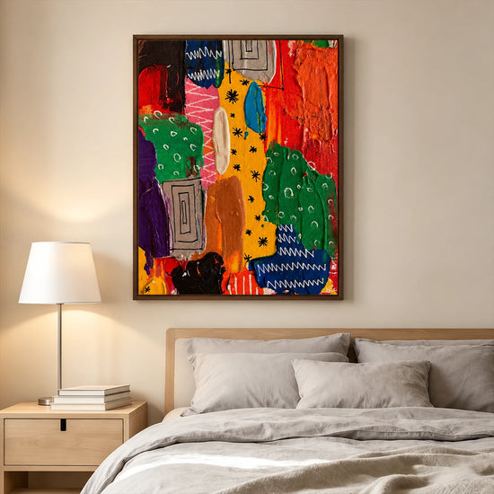 Color Rhythm painting above a bed with gray linens beside a light wood nightstand and lamp.