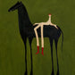 Full artwork of a slender black horse carrying a relaxed cream-colored rider with red boots against an olive-green background.