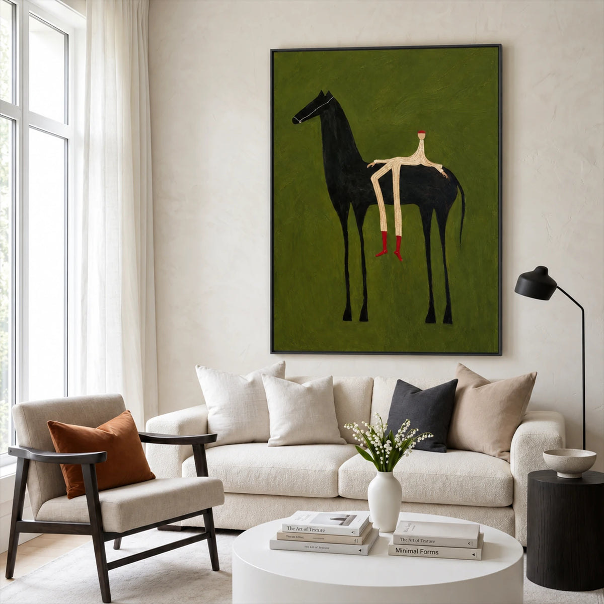 Emerald Rider painting above a cream sofa beside a wooden armchair in a softly lit living room.