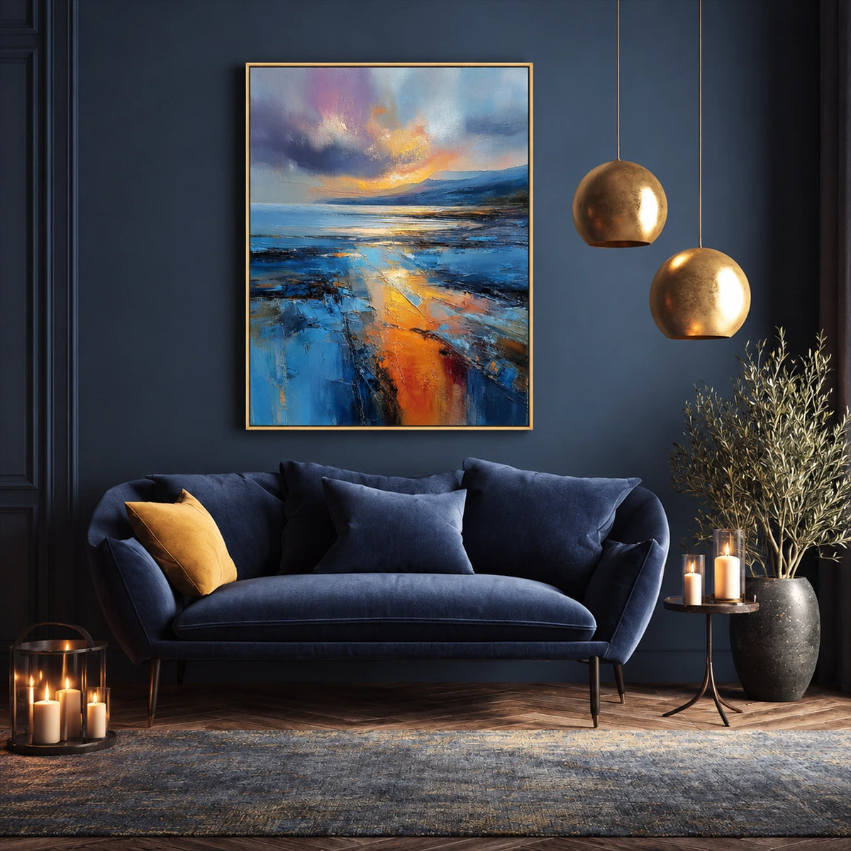 Amber Tide painting above a navy sofa beside two golden pendant lights.