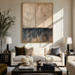 Weathered Calm painting above a cream sofa between two table lamps in a neutral living room.