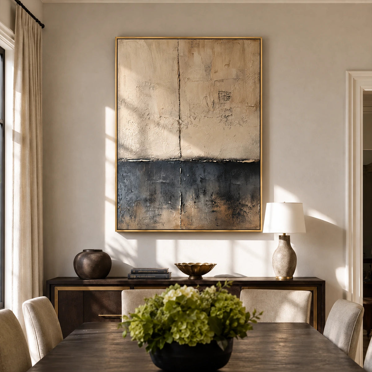 Weathered Calm painting above a sideboard behind a wooden dining table in a sunlit room.