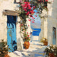 Full artwork of a cream-walled coastal passage with blue doors, pink flowering vines and a view of the sea.