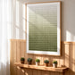 Olive Rhythm painting above a wooden shelf with small potted plants beside sheer curtains.