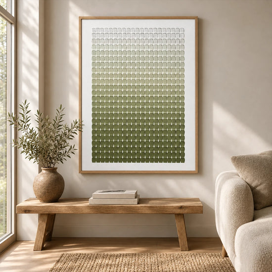 Olive Rhythm painting above a wooden bench beside a cream sofa and a vase of leafy branches.