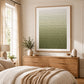 Olive Rhythm painting above a wooden dresser in a warm neutral bedroom.