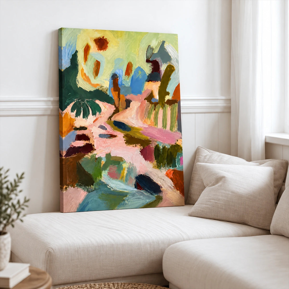 Pastel Reverie stretched canvas leaning beside a cream sofa in a bright room.