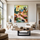 Pastel Reverie painting above two pale armchairs in a spacious neutral living room.