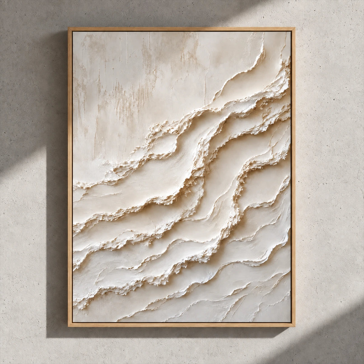 Ivory Tides painting in a natural wood frame on a gray wall crossed by sunlight.