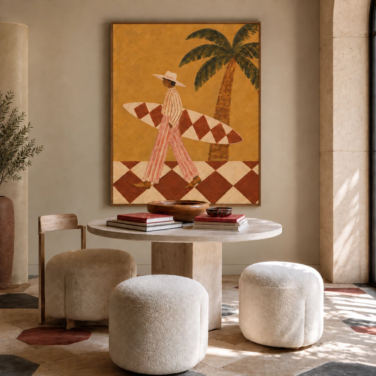 Ochre Surfer painting above a round table and pale upholstered stools in a warm neutral interior.
