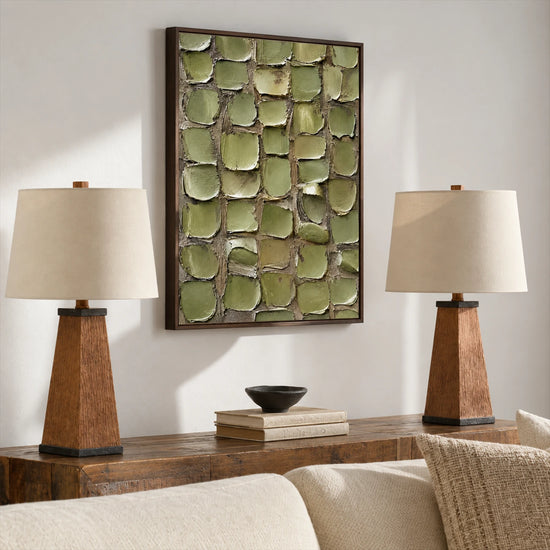 Olive Mosaic painting above a wooden console between two table lamps in a neutral living room.
