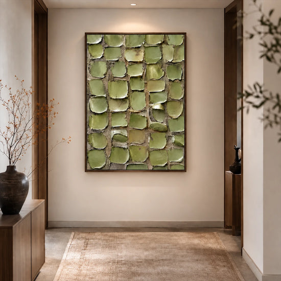 Olive Mosaic painting at the end of a softly lit hallway with a rug and decorative branches.