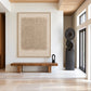 Linen Rhythm painting above a wooden bench beside a dark sculpture in a bright entryway.