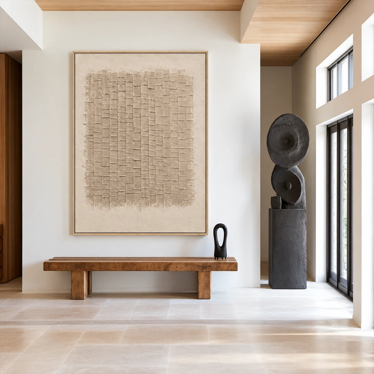 Linen Rhythm painting above a wooden bench beside a dark sculpture in a bright entryway.