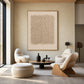 Linen Rhythm painting above curved cream seating and a low round table in a minimalist living room.