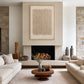 Linen Rhythm painting above a fireplace between pale sofas in a neutral living room.