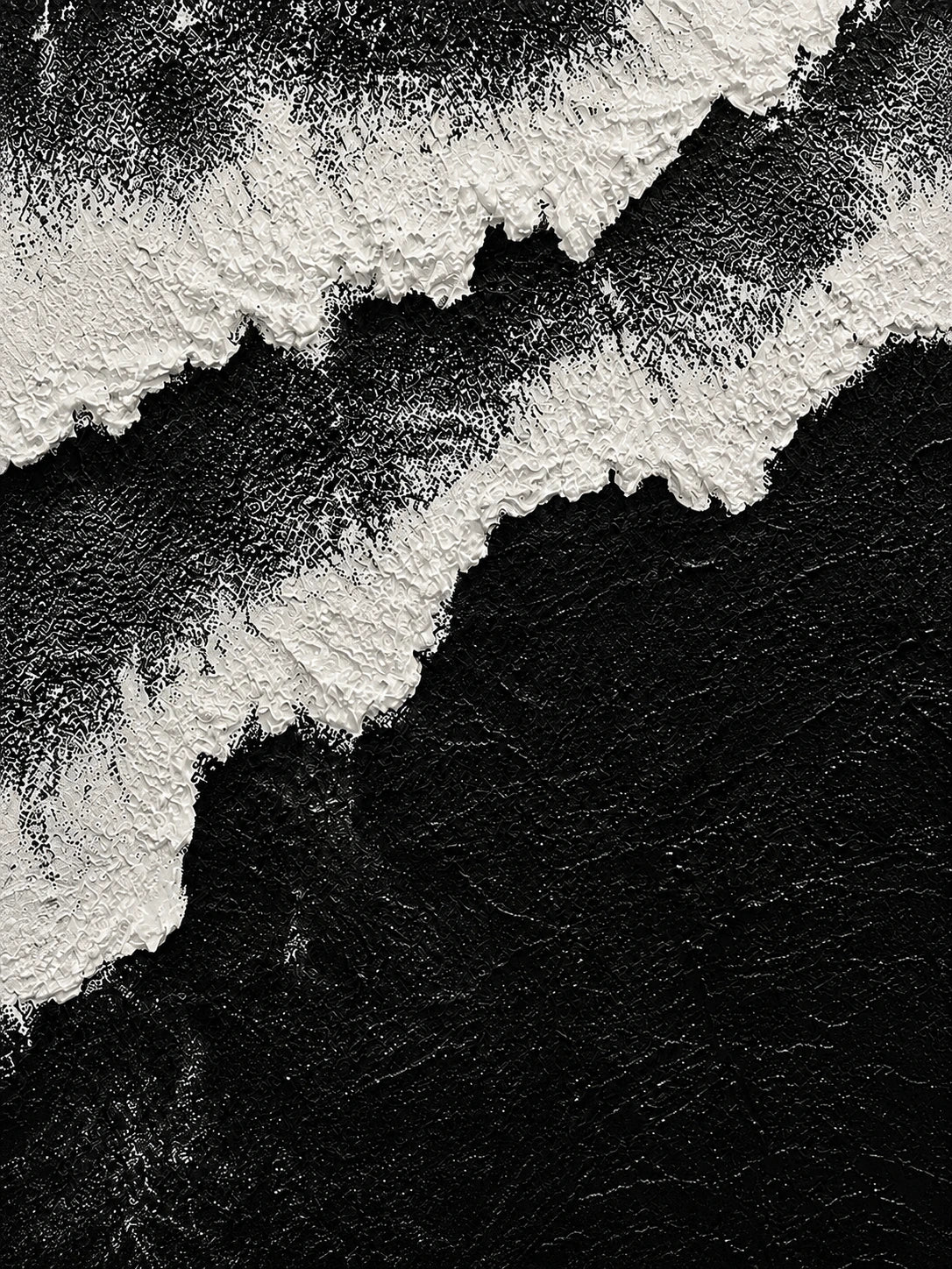 Full abstract artwork of irregular white foam-like bands sweeping diagonally across a deep black field.