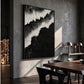 Midnight Surf painting on a concrete wall beside a wooden dining table and black chairs.