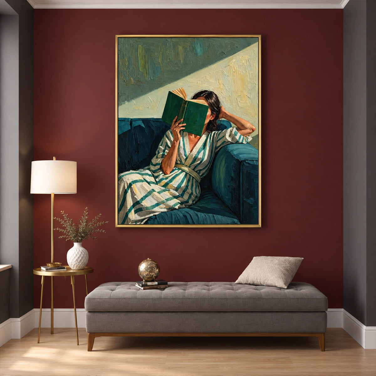 Sunlit Pages painting above a gray chaise against a burgundy wall with a small brass side table.