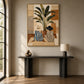Leafside Companions painting above a slim dark console beside a tall arched window.